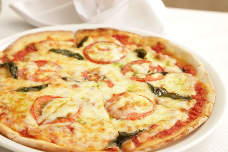 Fresh Margherita pizza with fresh basil and buffalo mozzarella