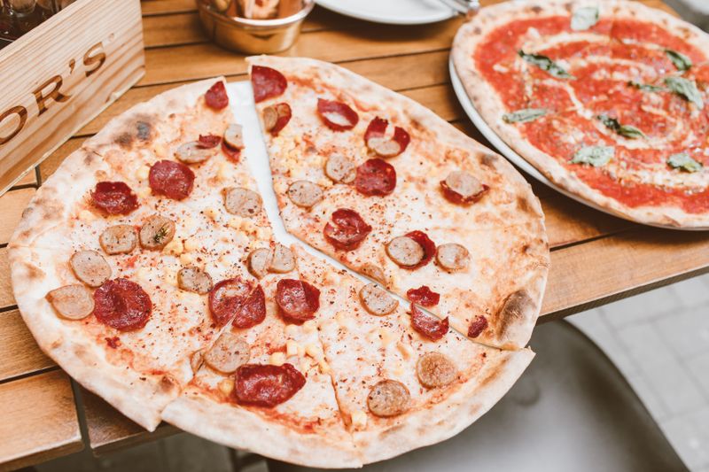 BBQ Chicken pizza with smoky sauce and caramelized onions